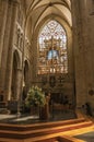 Stained glass, columns and altar at the St. Michael and St. Gudula Cathedral in Brussels. Royalty Free Stock Photo